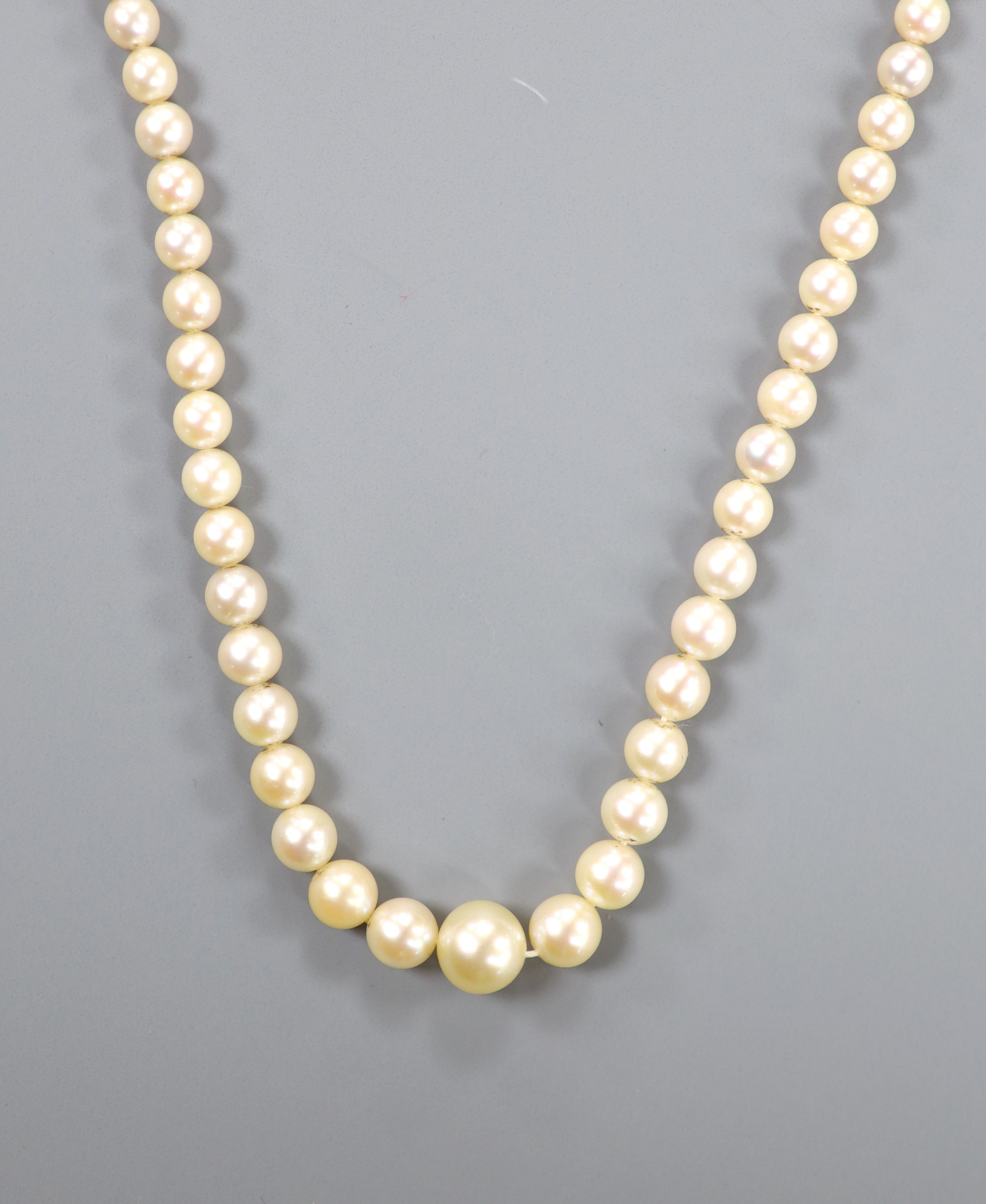 A single strand graduated cultured pearl necklace, with part of a 9ct gold clasp, 43cm.